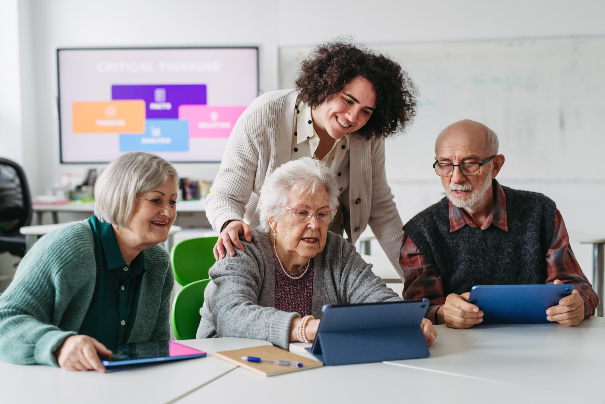 Seniors learning digital safety skills with a community educator — SAF community education program